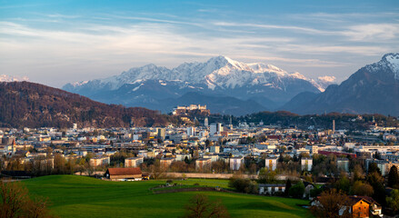 Famous city of Salzburg at sunset, in the background the snow-covered Berchtesgaden Alps, Austria,...