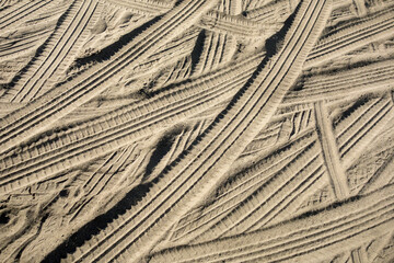 Car tire tracks in the sand
