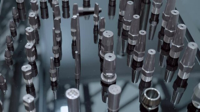 Sets of new copper, current, contact tips for spot welding. Shot in motion. Closeup