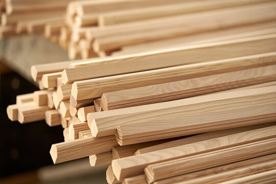A closeup of many wooden blanks for making furniture