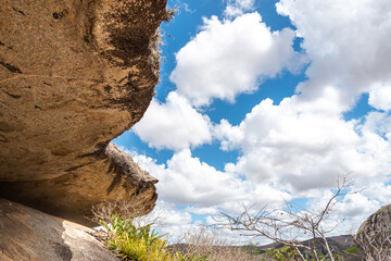 Blue sky with white clouds viewed from the entrance of a cave in rural Brazil