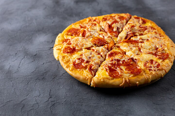 Tasty hot homemade pepperoni pizza. Traditional classic pizza with salami and cheese. With copy space for text.
