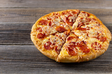 Tasty hot homemade pepperoni pizza. Traditional classic pizza with salami and cheese.