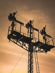 Railway track signal light with sunset