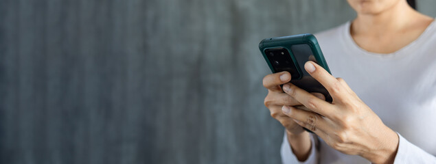 Hand of Woman using Smartphone with copy space for text background 