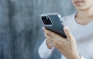 Close up Hand of Woman using Smart phone touch screen text messaging