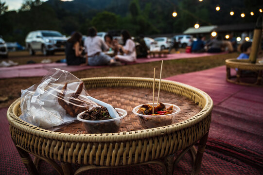 Khantoke Dinner in small market in Sapan Village At nan Thailand .A khantoke or khantok is a pedestal tray used as a small dining table by the Lanna people (of northern Thailand)