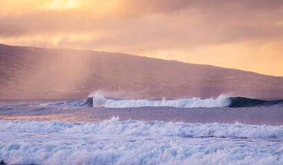 Azores islands, beach with amazing waves and colors, sunset.
