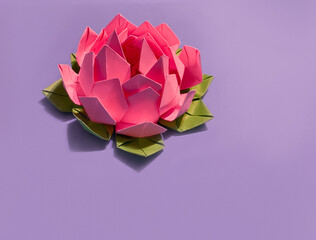 lotus flower origami on purple background