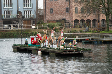Father Christmas on his sleigh on Chichester Canal West Sussex England	
