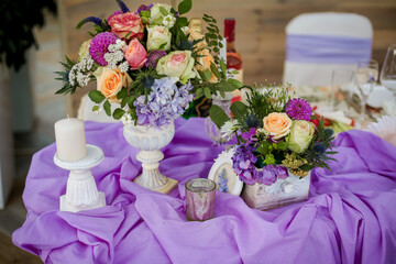 Bouquet of flowers on a purple table, Wedding decoration in purple