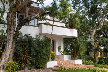 Fototapeta na wymiar Luxury villa in modern design in a tropical garden.