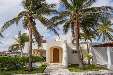 Fototapeta na wymiar Luxury villa in modern design in a tropical garden.
