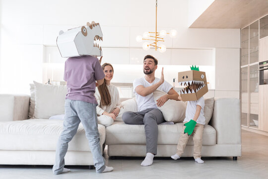 Family playing dinosaurs at home