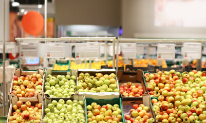 supermarket fruit counter,apples and pears on the shelves