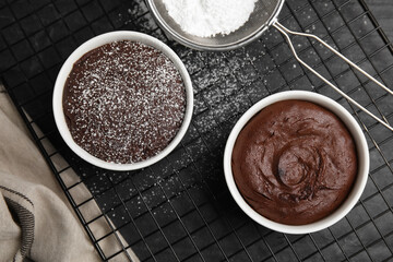 Delicious fresh chocolate fondant on black table, flat lay