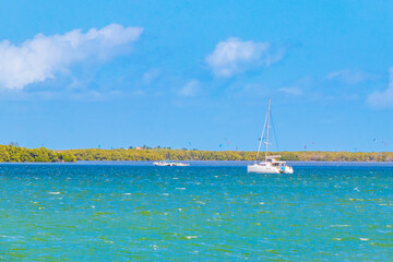 Luxury travel with yacht on Holbox island turquoise water Mexico.