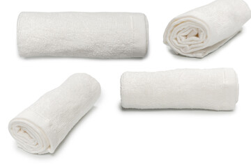 White fluffy cotton towel isolated on a white background.