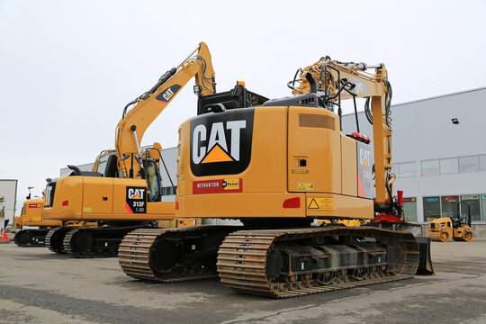 Cat Hydraulic Excavators on a Yard
