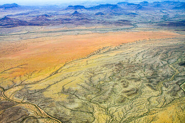 An aerial view of the beautiful colours of the landscape of Namibia's Kunene region in the north of the country.