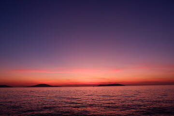 amazing sunset view with sea island and ferryboat