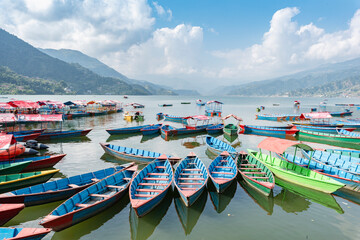 Fototapeta na wymiar Boats at Phewa Lake in Pokhara, Nepal