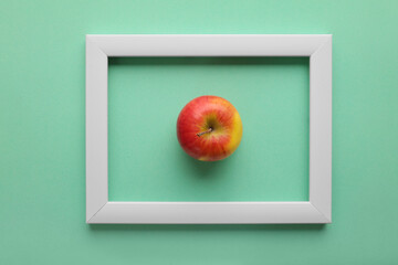 Fruit and frame on colored background