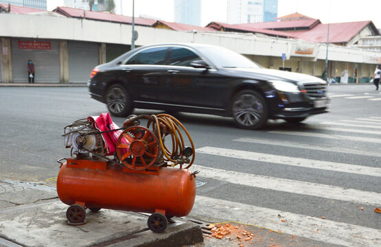 Tire pump machine on the side of the street in Ho Chi Minh City, Vietnam © hippomyta