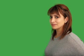 Fototapeta premium redhead woman on green screen lady in her thirties on chromakey background