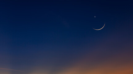 Naklejka na ściany i meble crescent moon on dusk sky twilight in the evening