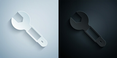Paper cut Wrench spanner icon isolated on grey and black background. Spanner repair tool. Service tool symbol. Paper art style. Vector
