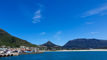 Fototapeta na wymiar Hout bay landscape panorama view on boat going out o seal island Cape Town, South Africa attraction