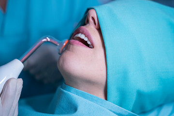 Patient receiving ozone dental treatment - obrazy, fototapety, plakaty