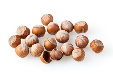 Heap of hazelnuts isolated on white background