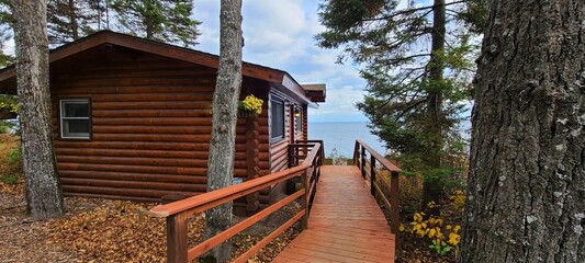 Cozy Log Cabin in the Wilderness and Near Water - obrazy, fototapety, plakaty