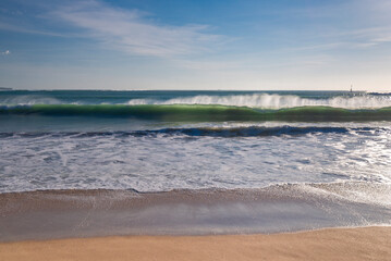 Big waves on Kedonganan beach at sunset time on Bali island in Indonesia