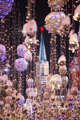 New year's bright Golden garland on the street in Moscow night. Nikolskaya Street in lights in the evening, near the Kremlin.