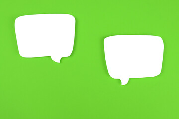 Text, speech bubbles on a green background