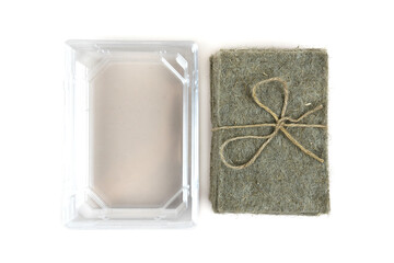 Stack of coconut coir and plastic substrate on a white background. Set for growing microgreens at home