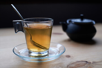 Transparent cup of green tea