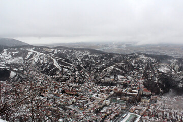 Beautiful old town of Brasov city, Romania. Photo from above. Winter holidays travel destinations.