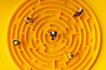miniature figurines of people in a maze