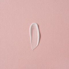 Cosmetic cream smudge setting on pink background. Aesthetic beauty cosmetic product