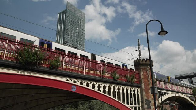 Train passing by and 301 Deansgate in background, Castlefield, Manchester, Lancashire