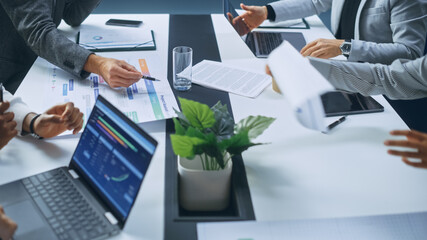 Multi-Ethnic Office Conference Room Businesspeople Meeting at Big Table. Diverse Team of Creative Entrepreneurs Talk, Find Solution. Specialists work in Digital e-Commerce Startup. Focus on Hands