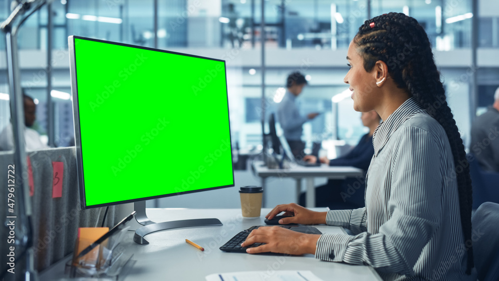 Poster diverse corporate office: beautiful black female it technician using desktop computer with green chr