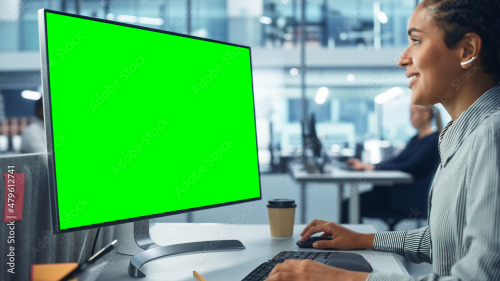 Poster diverse corporate office: beautiful black female it technician using desktop computer with green chr
