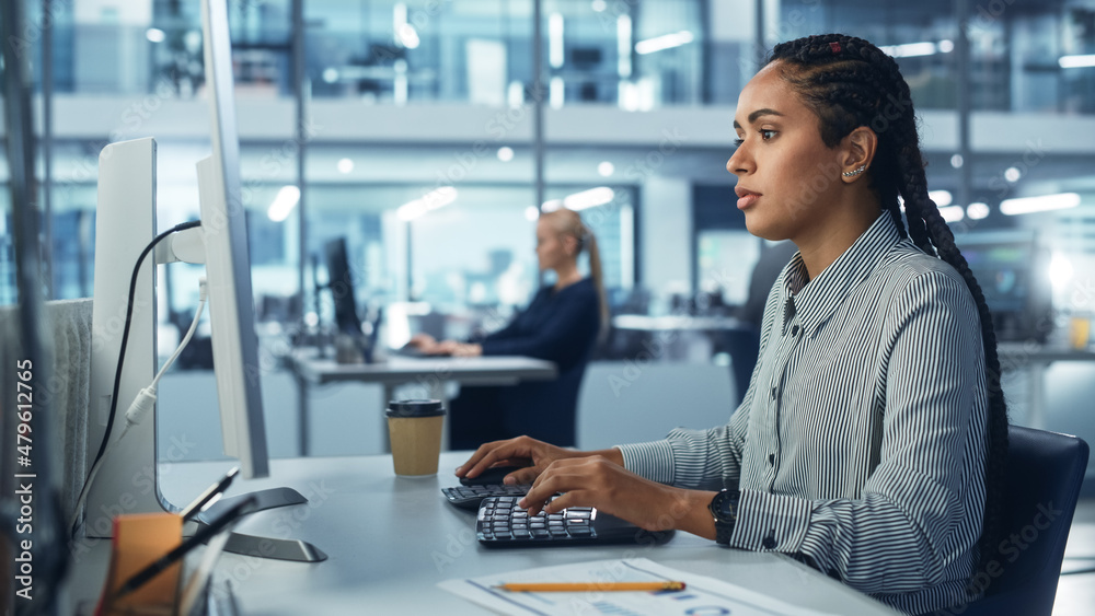 Poster corporate office: black female it technician using desktop computer, uses big data statistics, graph