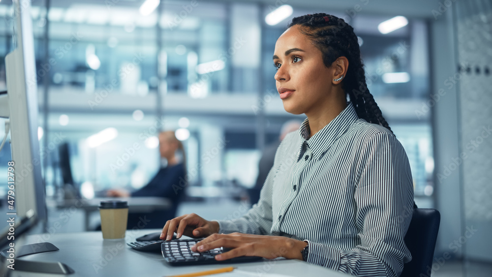Poster corporate office: black female it technician using desktop computer, uses big data statistics, graph