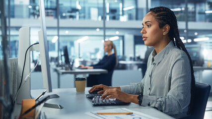 Corporate Office: Black Female IT Technician Using Desktop Computer, Uses Big Data Statistics,...